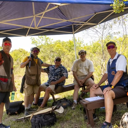 Members catching shade between stands at a Gold Valley shoot