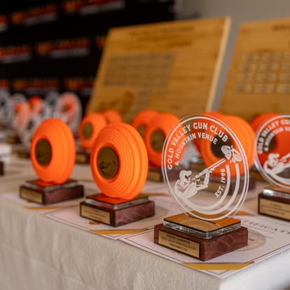 The prize table laid out with clay-orange trophies at Gold Valley