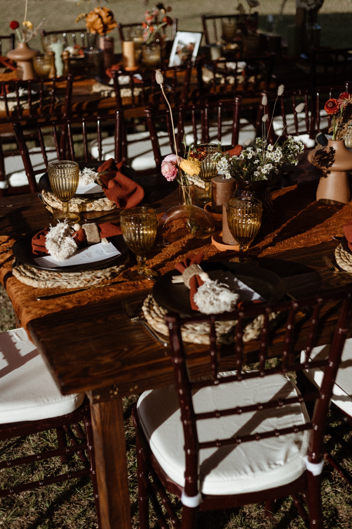 Golden-hour tablescape with amber glassware and florals