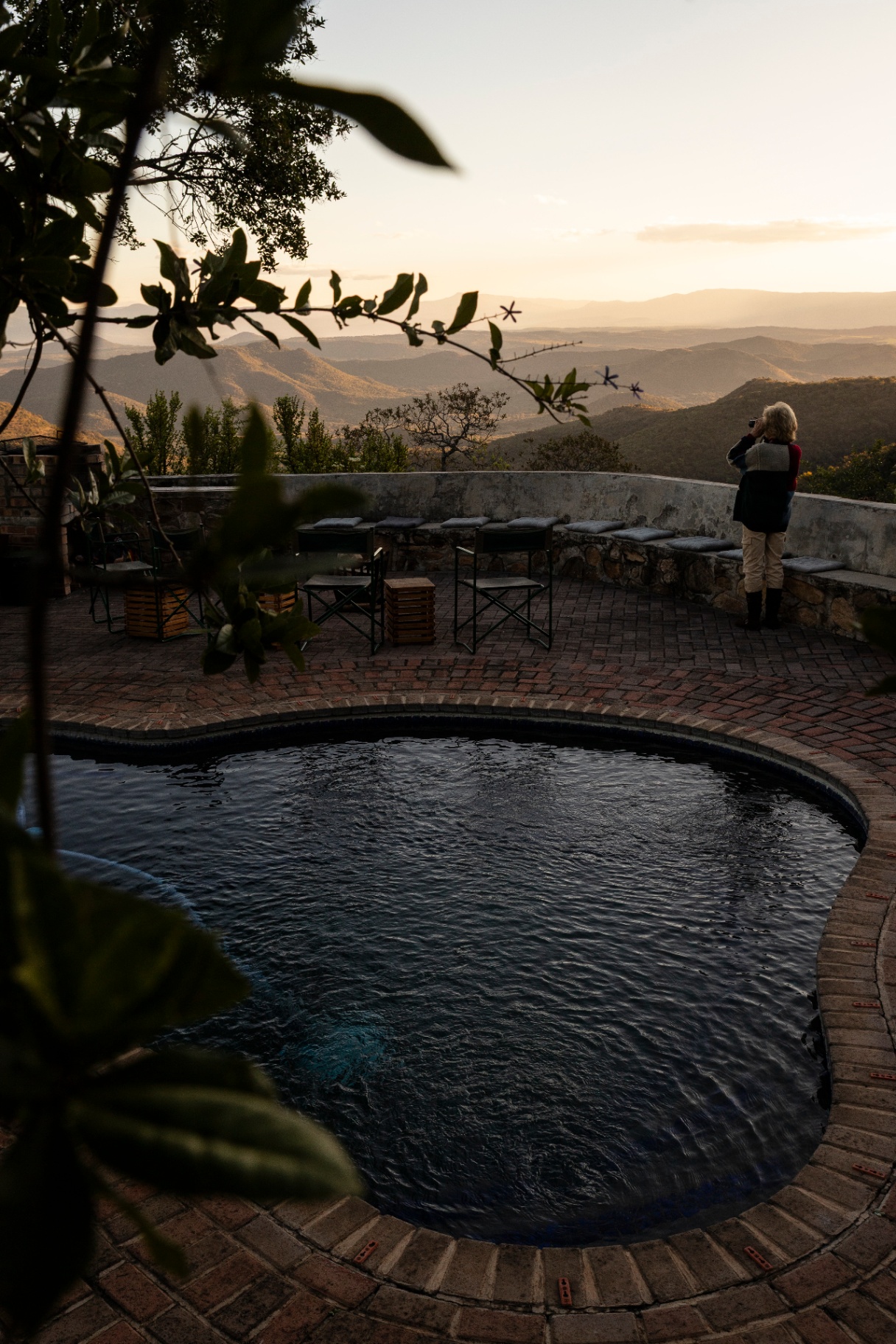 Rim-flow pool overlooking the De Kaap Valley at golden hour