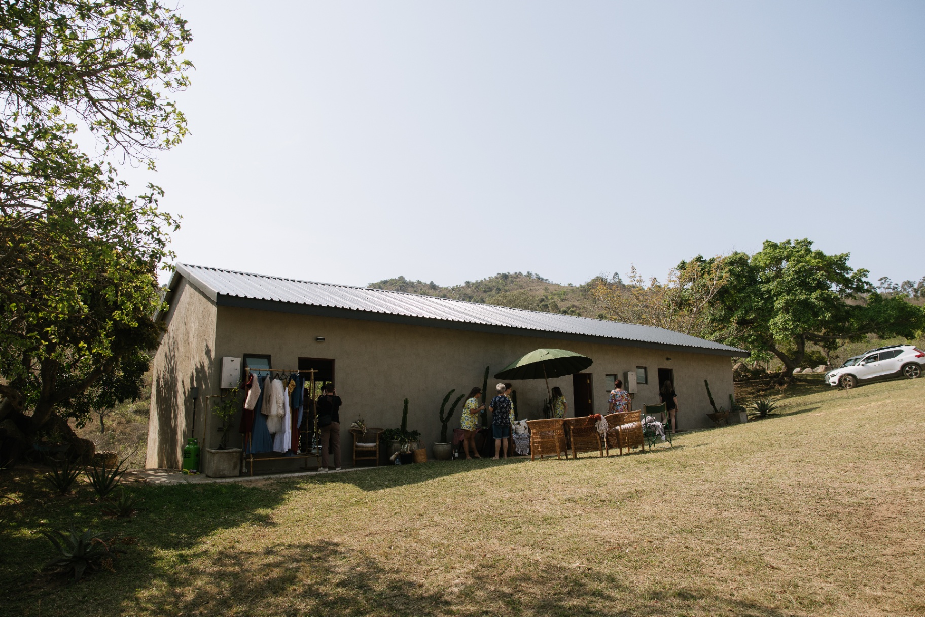 Bridal preparation cottage with dresses on the rail