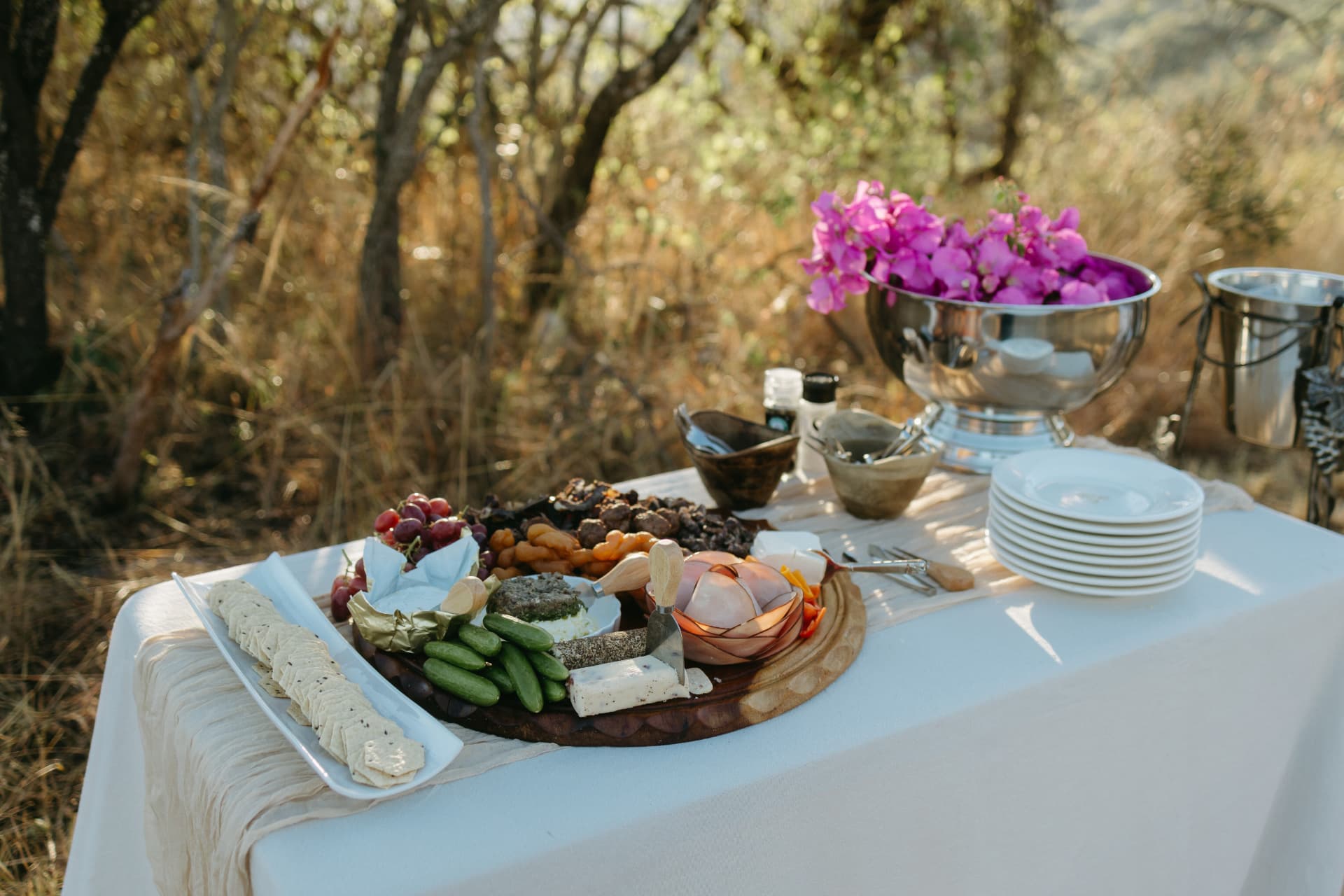 Cheese and charcuterie board on a white tablecloth