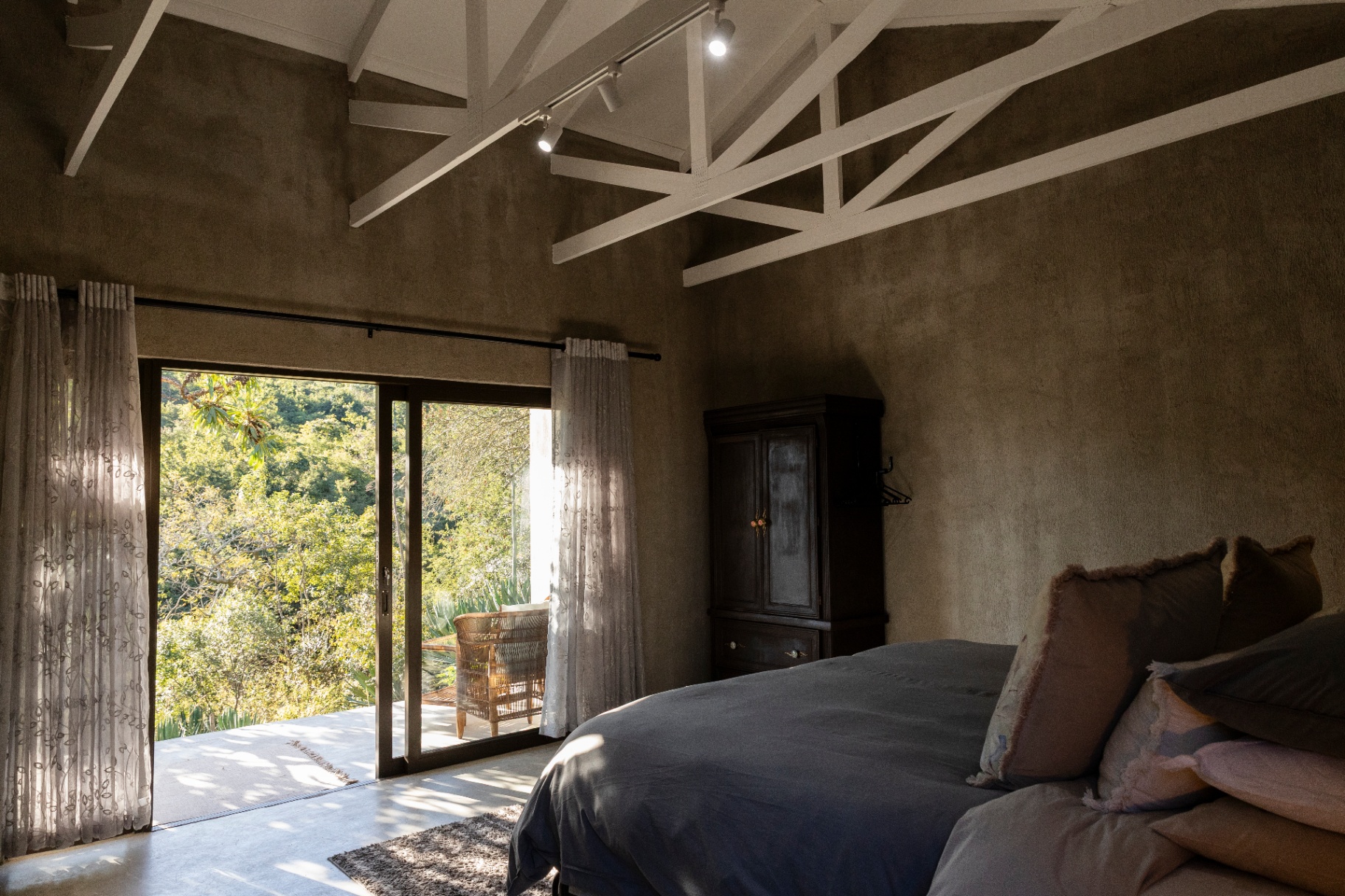 View from a bedroom out onto a sunlit deck