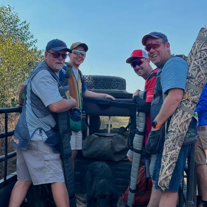 Members in the safari truck heading between Gold Valley stands