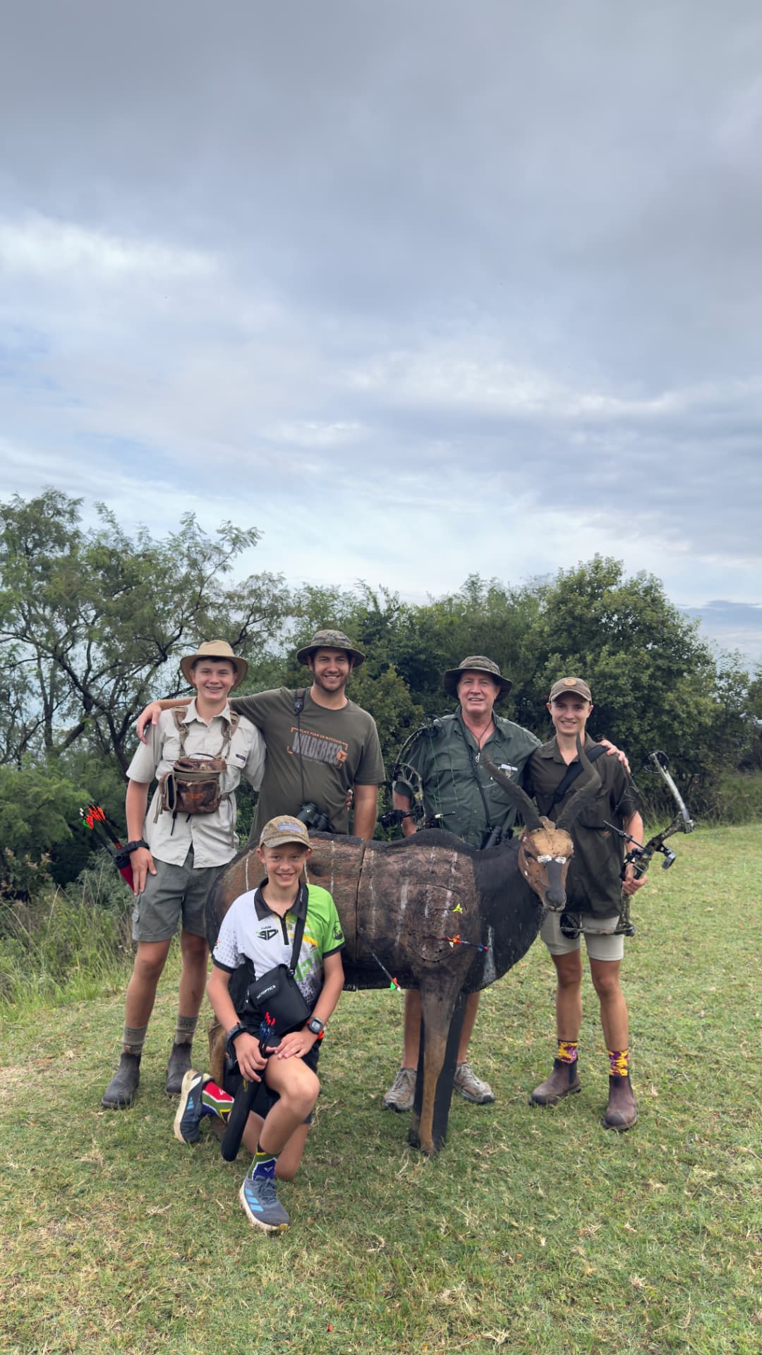 Family group at a 3D archery target on the estate