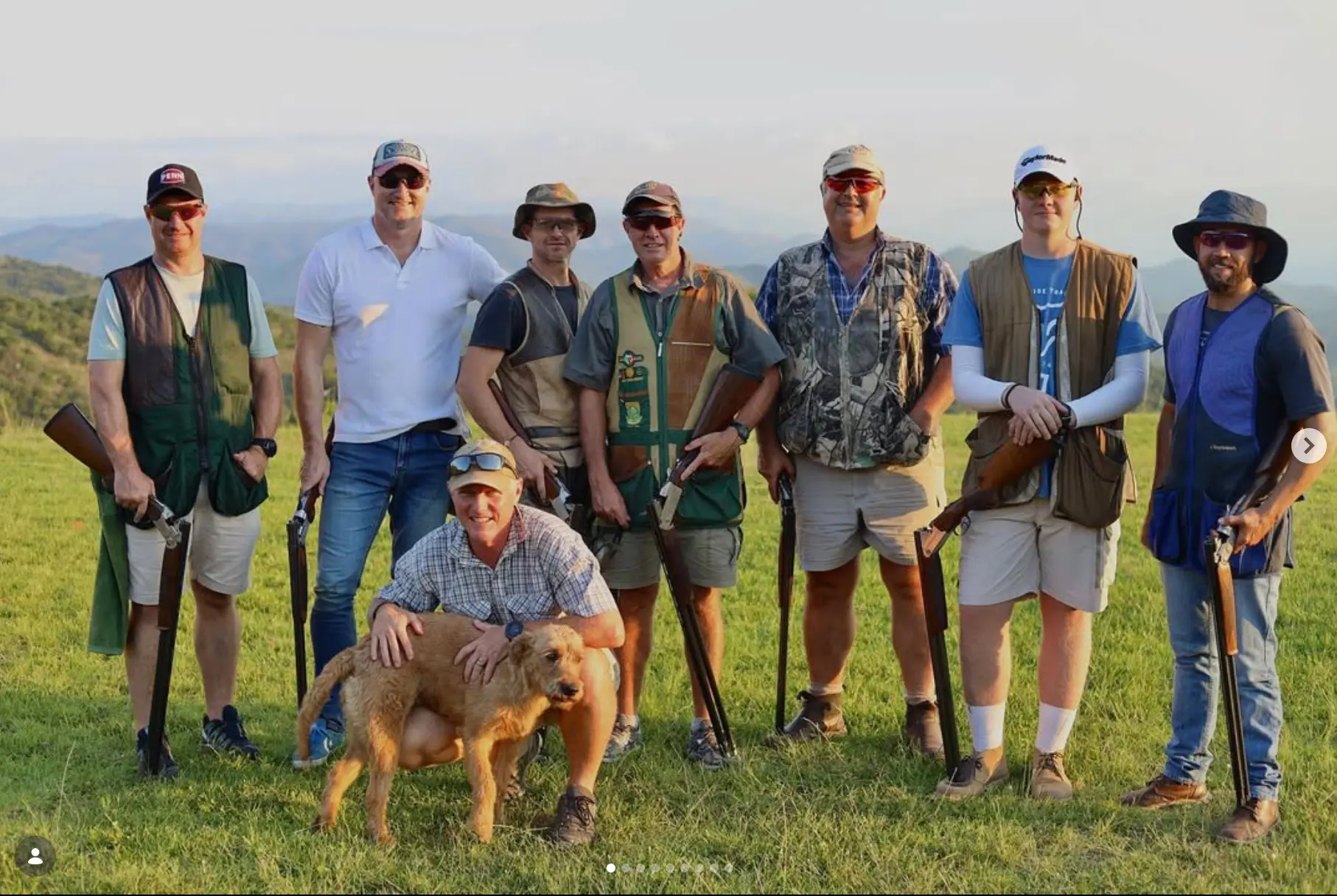 Eight shooters and the club dog after a round