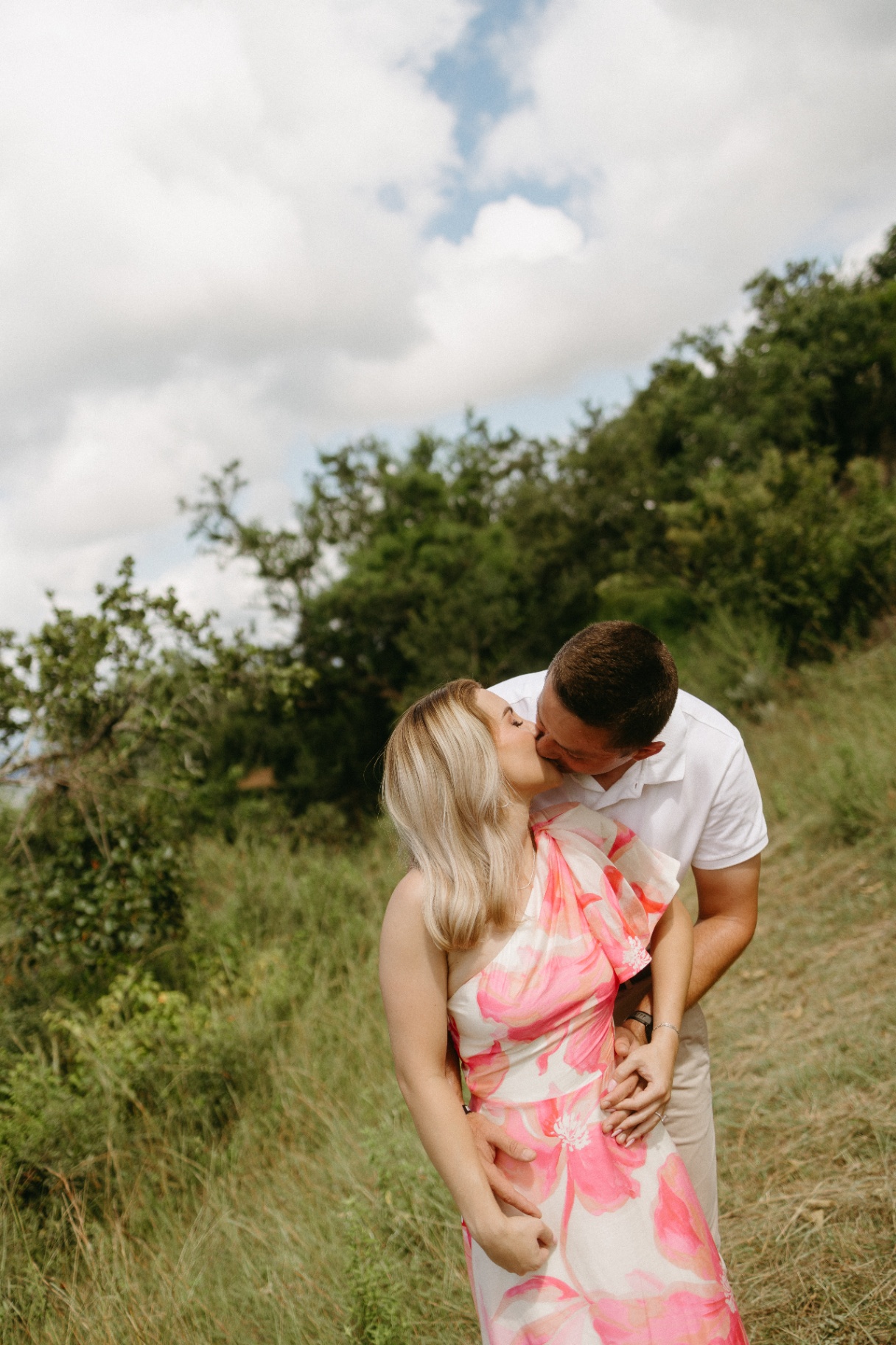 Couple sharing a kiss in the bushveld