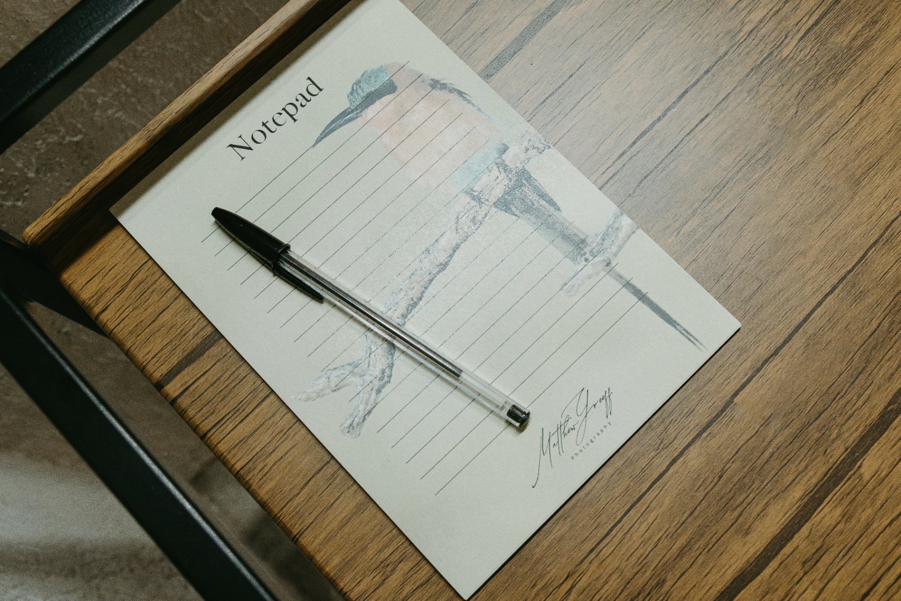 Kingfisher notepad on a wooden desk