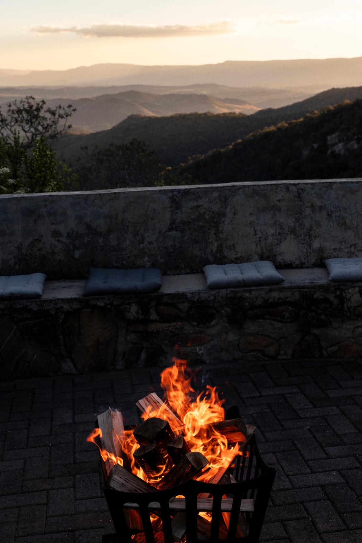Fire pit at dusk with mountain views