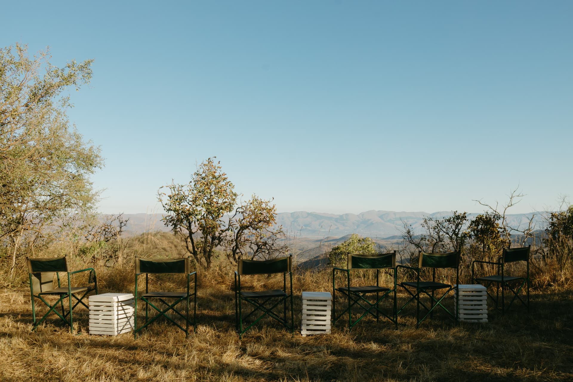 Safari chairs set in a circle overlooking the valley