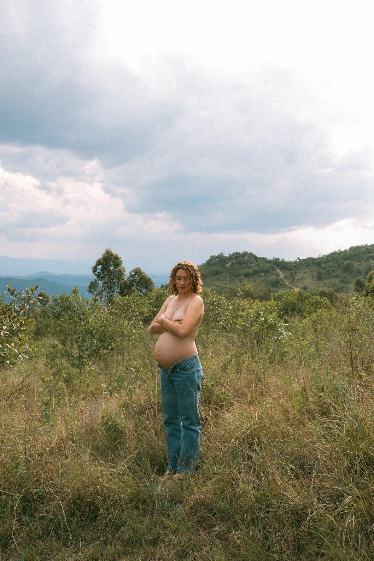 Expecting mother on a ridge overlooking the Lowveld valley