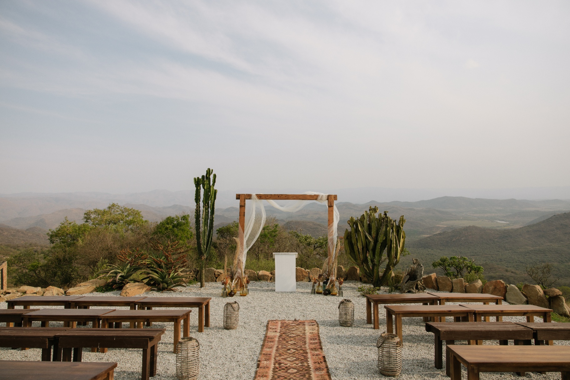 Outdoor ceremony setup overlooking the De Kaap Valley at The Knot & Barrel