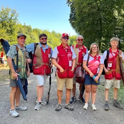 Sporting team of six in red club shirts at Gold Valley