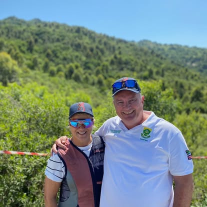 Two Gold Valley members with the Lowveld mountains behind